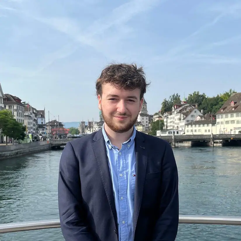portrait of elia ritzmann standing on a bridge in zurich